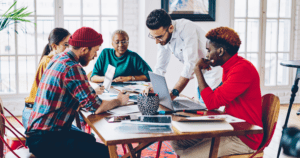 Students working together around table