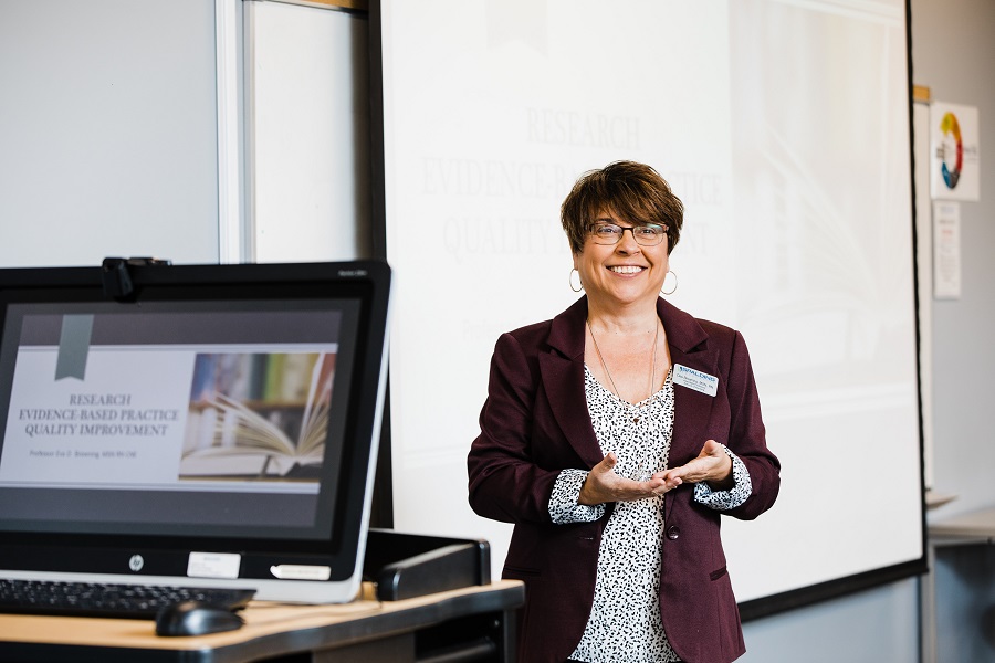 Dee Browning, Spalding nursing faculty, teaching in front of classroom