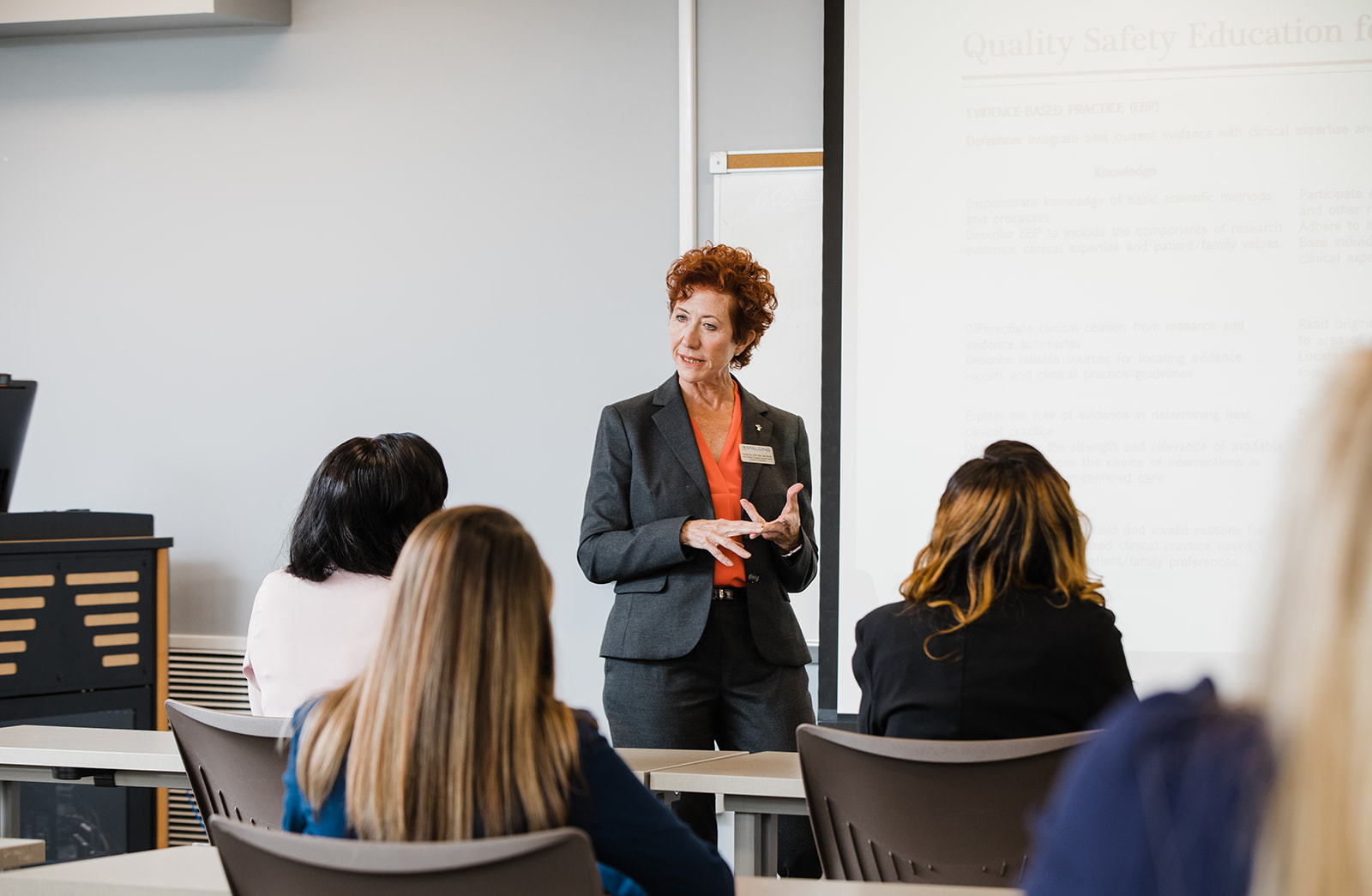 Dr. Pam Elzy, Spalding Nursing Faculty, teaching in front of a class of students