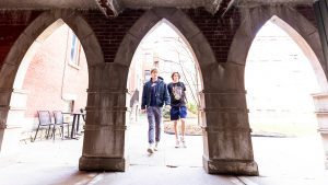 two students walking on campus