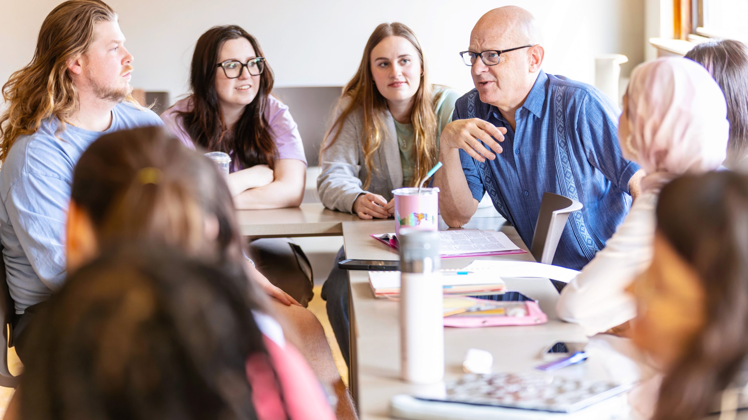 professor teaching small group of students